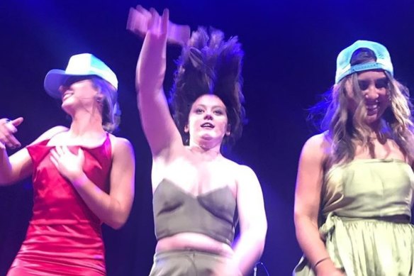 Bridgette, Caroline and Julia Joyce, daughters of Barnaby Joyce, on stage at the White Elephant Ball in Tamworth last weekend.