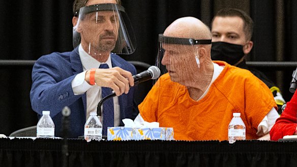 Joseph Cress, left, the public defender for Joseph James DeAngelo, charged with being the Golden State Killer, adjusts the microphone for his client during a hearing in Sacramento Superior Court in Sacramento, California. 