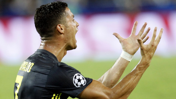 Stunned: Cristiano Ronaldo reacts after being shown a straight red card.