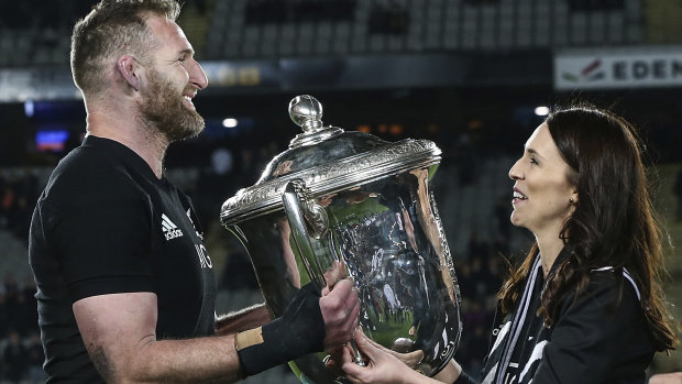 Safe for another year: Kieran Read receives the Bledisloe Cup from New Zealand Prime Minister Jacinda Ardern.