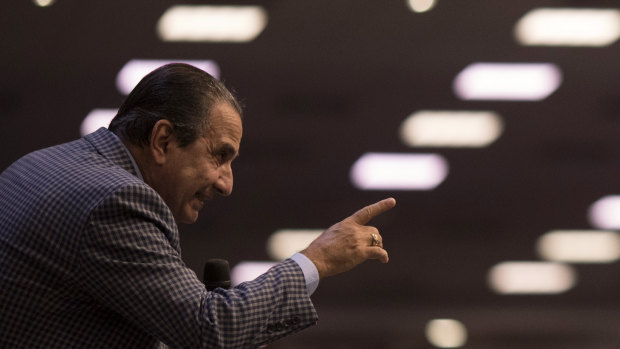 Pastor Silas Malafaia points to his congregants during a service at the Assembly of God Victory in Christ Church, in Rio de Janeiro.