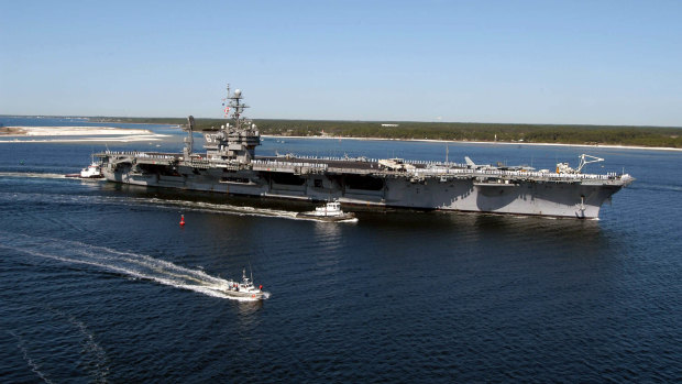 This Navy handout photo shows the USS John F. Kennedy arriving at Naval Air Station Pensacola in 2004.