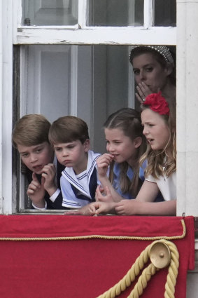 Princess Beatrice in the background wearing one of her signature embellished headbands with Prince George, Princess Charlotte and Prince Louis during Trooping The Colour.