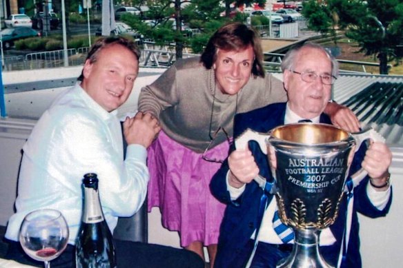 The late Alex Popescu (right) with Brian Cook and the 2007 Geelong premiership cup.