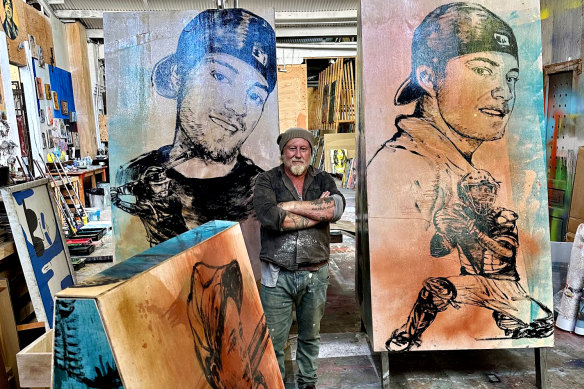 Artist David Bromley in his Daylesford studio with his paintings of Chris Lane. 