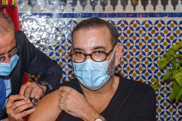 Morocco’s King Mohammed VI receives the COVID-19 vaccine at the Royal Palace in Fez. 