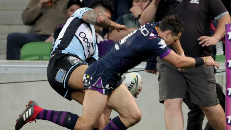 Controversial hit: Billy Slater shoulder charges Sosaia Feki.