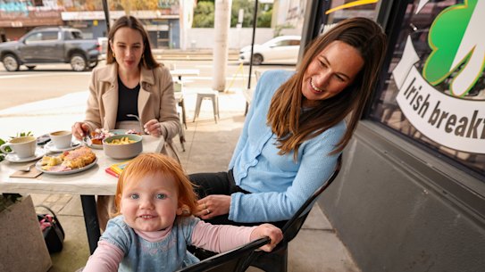 Ruby Davies-Nelson with daughter Bonnie and friend Susannah McCaughan at Cafe Jack’s in Kensington. Both mothers manage screen time with other activities when dining out.