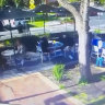 A still from CCTV footage shows a killer dressed in black approaching Gavin Preston before he is shot outside a cafe.