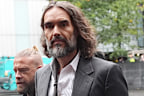 One of Russell Brand’s six accusers told a London court the comedian turned into a “wild-eyed maniac” when he tried to drag her into a toilet cubicle at her workplace.