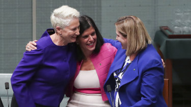 Crossbench MPs Kerryn Phelps, Julia Banks and Rebekha Sharkie celebrate after the bill passes the House of Representatives.