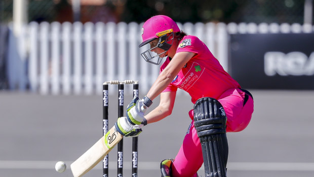 Alyssa Healy cracks a full delivery through the offside for the Sydney Sixers.
