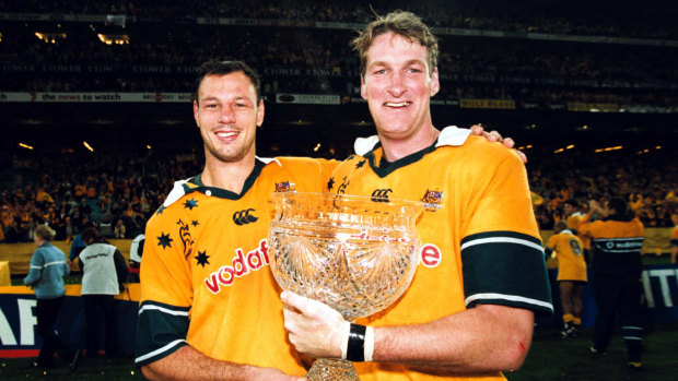 Glory days: Justin Harrison, right, with Matt Cockbain, celebrates a momentous win on debut for Australia. 