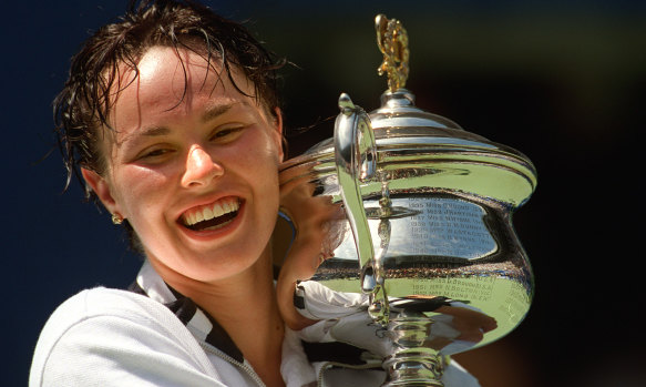 Martina Hingis with one of her three Australian Open singles trophies.