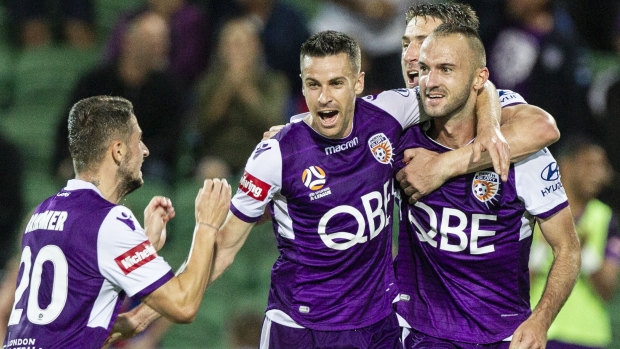 Perth Glory players celebrate the lone goal against Newcastle that clinched the Premiers Plate.