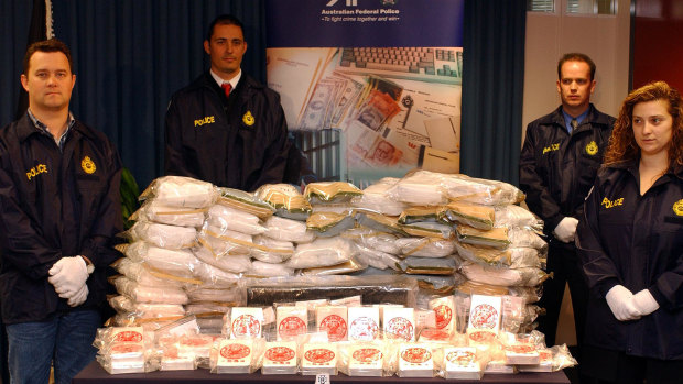 AFP officers display a heroin haul linked to the Pong Su.