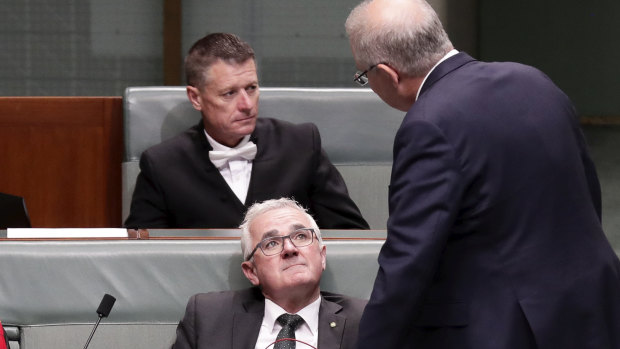 Crossbench MP Andrew Wilkie speaks with Prime Minister Scott Morrison after a division in the House of Representatives on December 6.