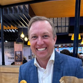 Premier Steven Miles at McDonald’s in Central Station after catching the train on Monday morning.