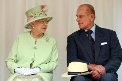 Queen Elizabeth talks with The Duke of Edinburgh as she waits to rededicate the rainforest walk, as she tours Southbank , in Brisbane, Queensland, in 2011.