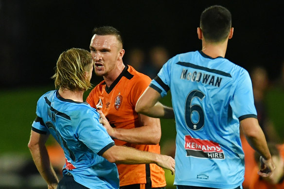 Tom Aldred of Brisbane and Sydney's Rhyan Grant in an altercation during the Sky Blues' 1-0 win.