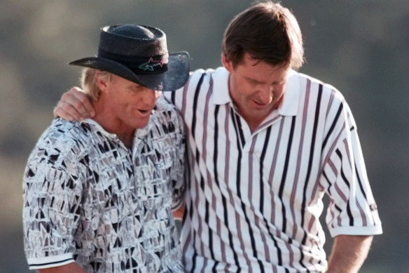 Greg Norman (left, pictured with Nick Faldo) has helped Dustin Johnson to a win at the Masters this year.