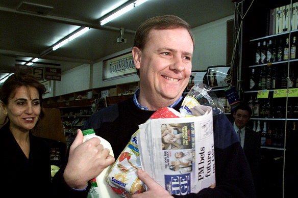 Peter Costello buys groceries on the first day of the GST on July 1, 2000. The GST marks the last far-reaching reform of the nation’s tax system.