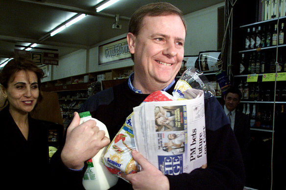 Peter Costello buys groceries on the first day of the GST on July 1, 2000. 