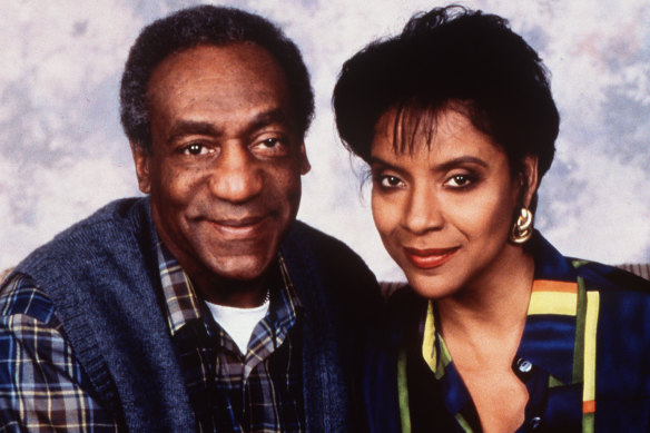 The picture of respectability: Cosby as obstetrician Cliff Huxtable, with Phylicia Rashad as his lawyer wife Clair, on The Cosby Show. 