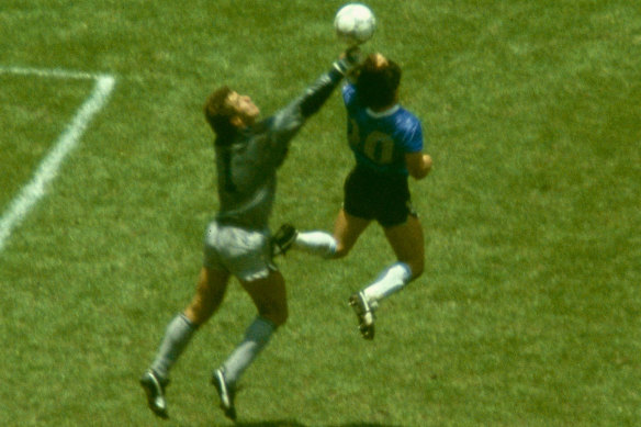 Maradona outjumps England goalkeeper Peter Shilton to score his 'Hand of God' goal.