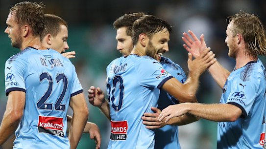 Star turn: Milos Ninkovic soaks in the plaudits after scoring against Melbourne Victory.