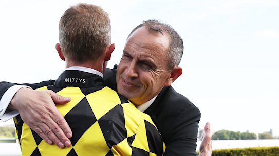 Chris Waller embraces Kerrin McEvoy after Autumn Glow’s win.