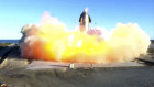 SpaceX's Starship becomes engulfed in flames and ruptures upon touching down after a test flight. 