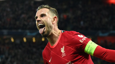 Liverpool’s Jordan Henderson celebrates the Reds’ opener at Anfield, eventually deemed a Pervis Estupinan own goal.