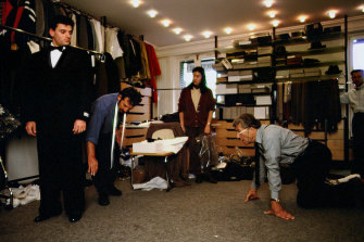 Nino Cerruti (kneeling, right) and sons prepare for the Cerruti 95-96 fashion show.  The stylish entrepreneur turned his family’s textile factory in north-west Italy into a global fashion brand. 