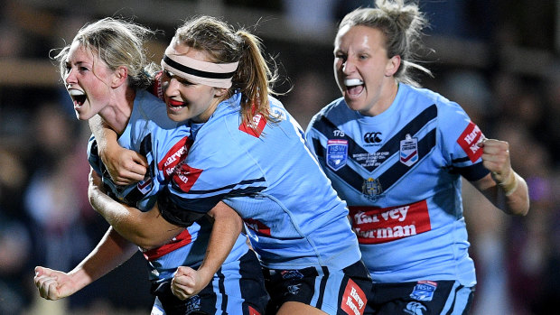 Match-winner: Maddie Studdon celebrates her solo try that put the match beyond Queensland.