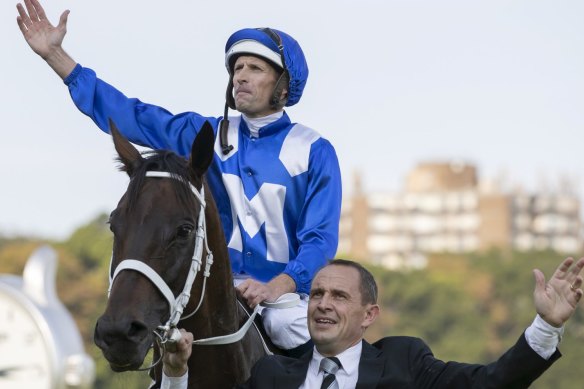Hugh Bowman and Chris Waller with Winx after the Queen Elizabeth Stakes.