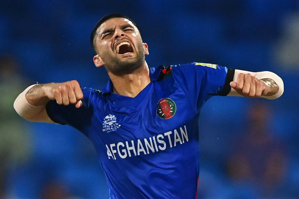 Naveen-ul-Haq of Afghanistan celebrates the wicket of Scotland’s Matthew Cross in Sharjah.