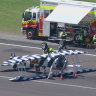 Vintage biplane lands upside-down at NSW airport