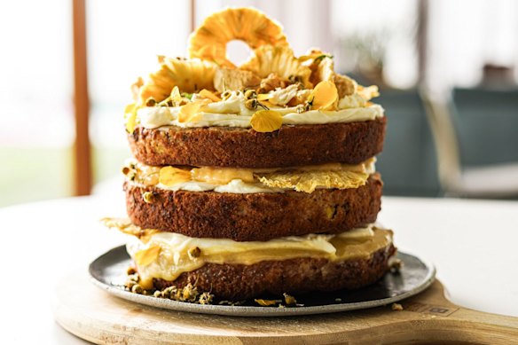Sunshine on a plate: Hummingbird cake stacked with lemon curd and cream cheese icing, and topped with golden-hued decorations if you're feeling 'extra'.