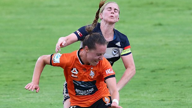 Eyes wide shut: Victory goalscorer Natasha Dowie clashes with Celeste Boureille of the Roar.