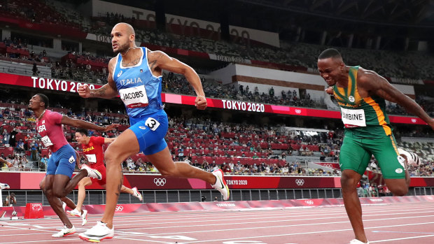 Italian Lamont Marcell Jacobs crosses the line first in the men’s 100m final at Olympic Stadium.