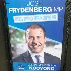 Campaign ads for Treasurer Josh Frydenberg have been defaced in Kooyong.