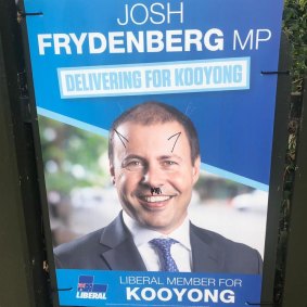 Campaign ads for Treasurer Josh Frydenberg have been defaced in Kooyong.