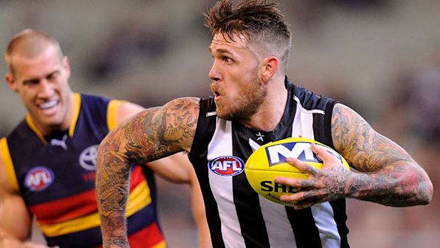 Scott Thompson chases Collingwood's Dane Swan last year.