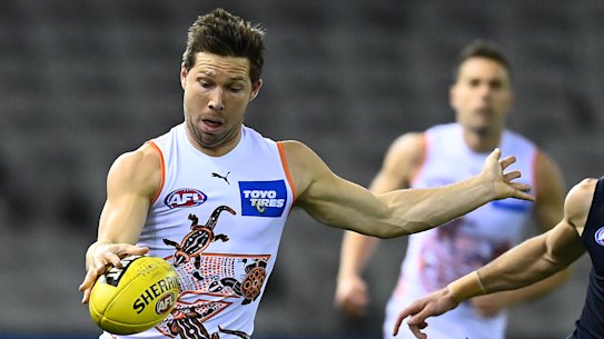 Toby Greene gets a kick away.