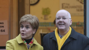 Then-Scottish first minister Nicola Sturgeon poses for the media with husband Peter Murrell, outside polling station in Glasgow, Scotland in 2019.