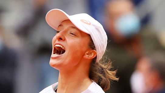 Iga Swiatek of Poland celebrates after winning the title. 