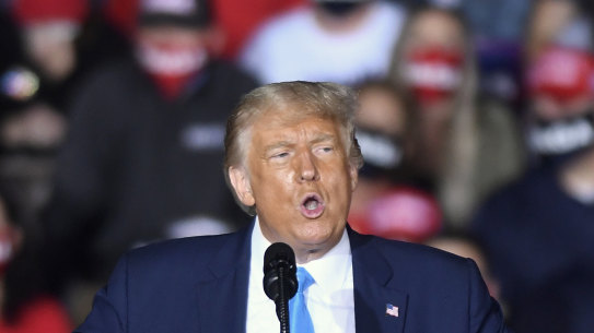 President Donald Trump speaks during a campaign rally at Harrisburg International Airport in September. The President's campaign has been virtually halted overnight by his diagnosis with coronavirus.  