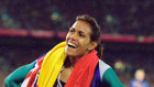 Cathy Freeman wins gold under two flags. 