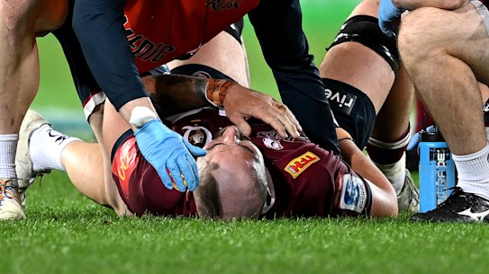 Queensland’s Connor Vest receives medical assistance on Friday.
